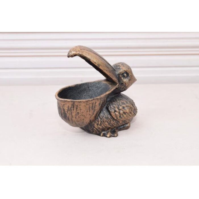 VINTAGE CAST IRON FUNNY PELICAN STATUE