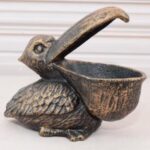 VINTAGE CAST IRON FUNNY PELICAN STATUE