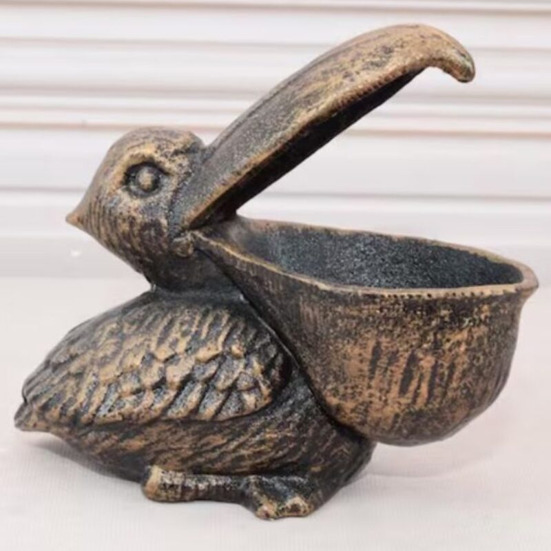 VINTAGE CAST IRON FUNNY PELICAN STATUE