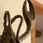 BRASS-EFFECT LOBSTER WALL LIGHT