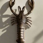 BRASS-EFFECT LOBSTER WALL LIGHT
