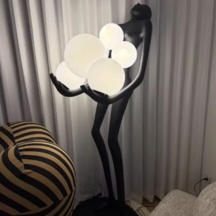 FIGURE HOLDING FLOATING GLOBES SCULPTURAL FLOOR LAMP