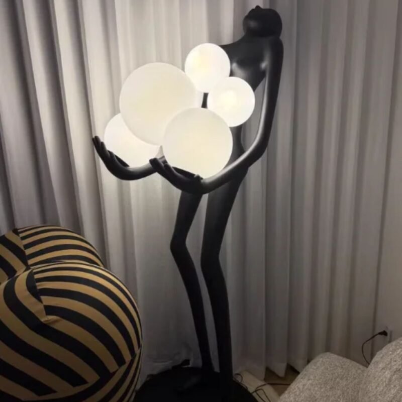 FIGURE HOLDING FLOATING GLOBES SCULPTURAL FLOOR LAMP