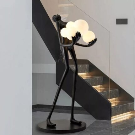 FIGURE HOLDING FLOATING GLOBES SCULPTURAL FLOOR LAMP