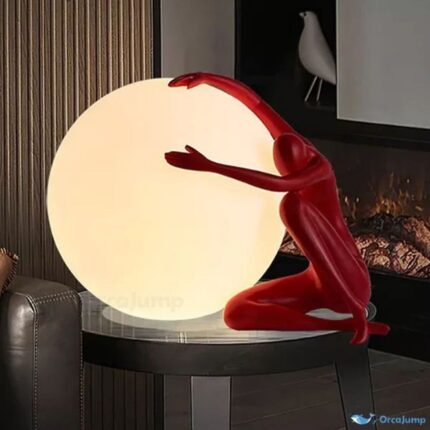 RED FIGURINE WITH LUMINOUS GLOBE TABLE LAMP