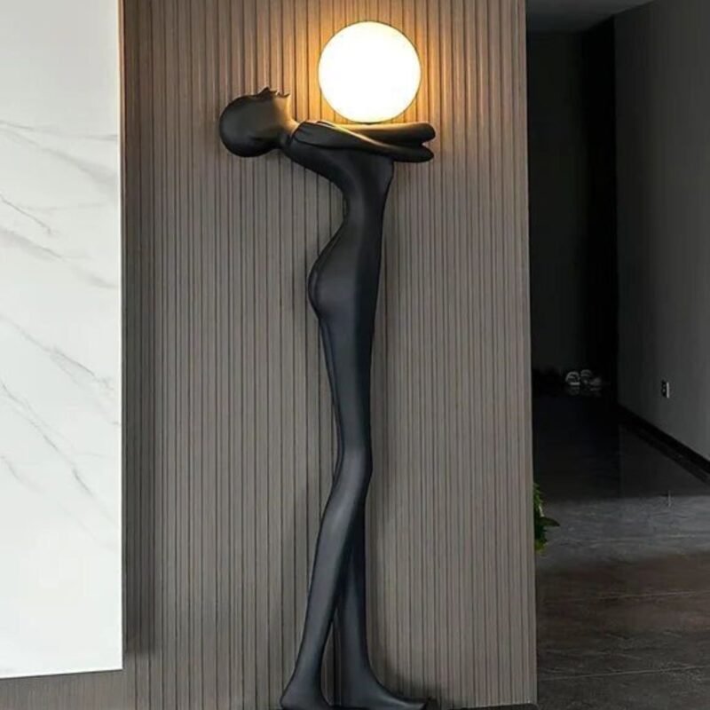 FIGURE HOLDING GLOWING ORB SCULPTURAL FLOOR LAMP