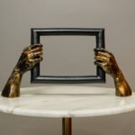 Hands Framing Time Form — bronze and black resin metal on table art sculpture for home decor, sculptures for sale at Lume Art Gallery
