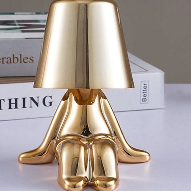 GOLDEN BOY SITTING TABLE LAMP