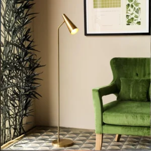 Antique brass floor lamp in bedroom corner providing layered lighting with bedside table lamp