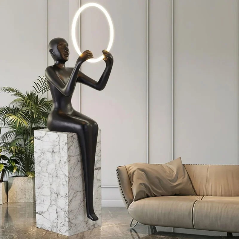 Bella Sitting Sculpture floor lamp with elegant feminine silhouette in modern interior