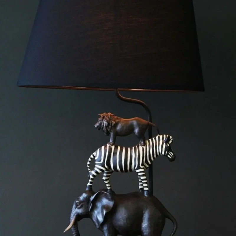 Animal sculpture featuring Captain Elephant bust in classic safari style on console table