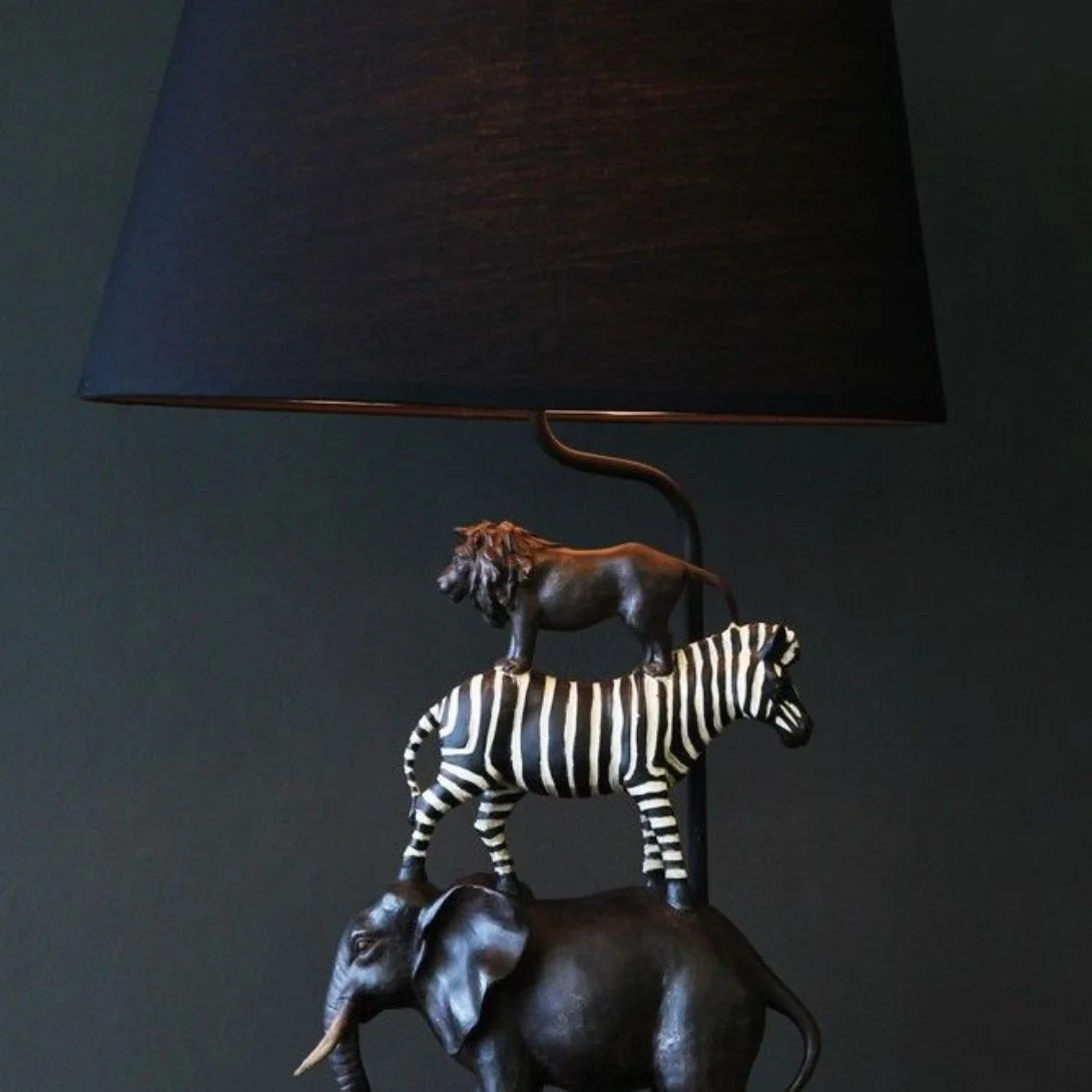 Animal sculpture featuring Captain Elephant bust in classic safari style on console table