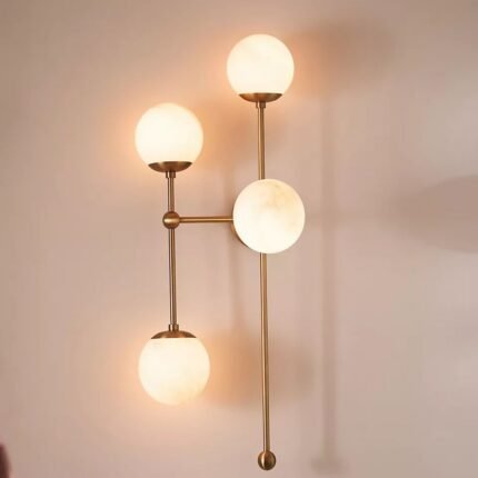 ARMSTRONG FOUR-LIGHT BRASS AND GLASS SCONCE WALL LIGHT