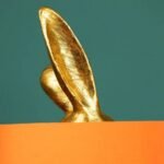 DECORATIVE BUNNY TABLE LAMP IN GOLD AND ORANGE