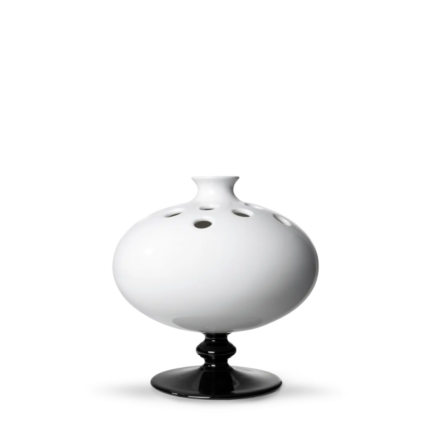 DELFT WHITE PERFORATED VASE BY MARCEL WANDERS with circular stem-hole openings across the body and glossy black turned pedestal base