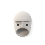 THE PARTY BERT WALL LAMP BY KRANEN GILLE — white ceramic face wall lamp with circular eye openings, rectangular nose bridge, and oval mouth aperture