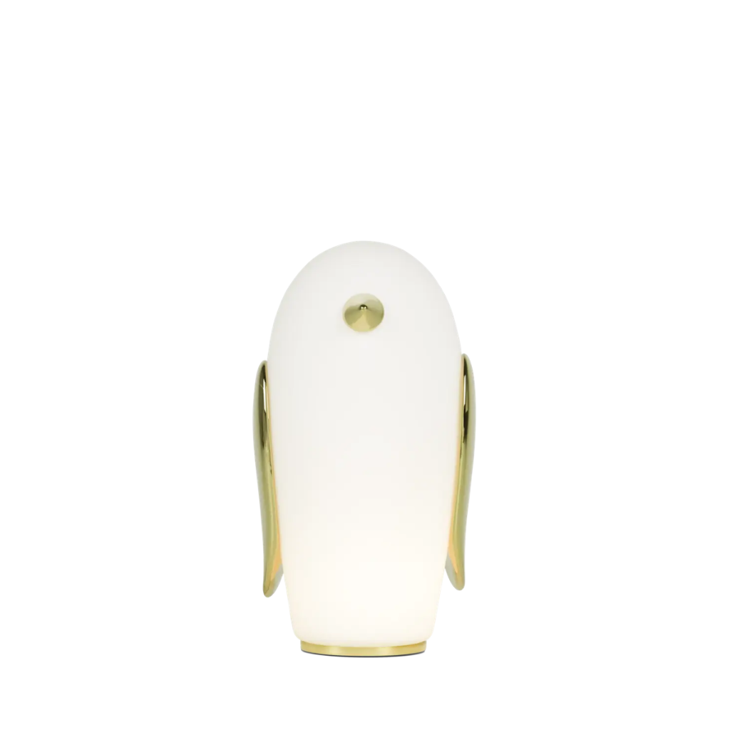 PET PENGUIN TABLE LAMP BY MARCEL WANDERS — tall glass body with gold wings, small crown button, and circular gold base PET PENGUIN TABLE LAMP BY MARCEL WANDERS — tall glass body with gold wings, small crown button, and circular gold base