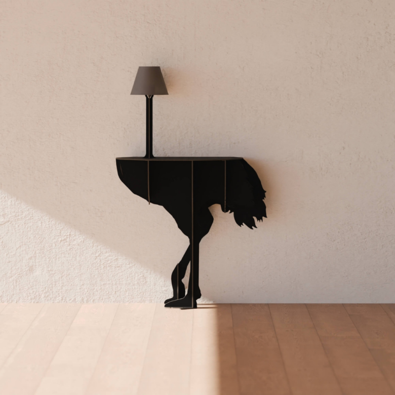 BLACK OSTRICH WALL LAMP by Rachel & Benoît Convers — flat cut ostrich body with slim pole table lamp, photographed against a textured cream wall with warm wood floor