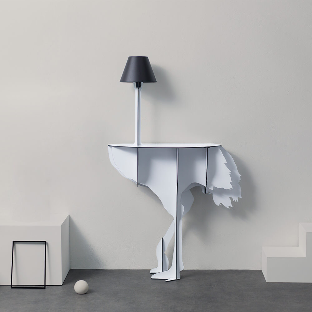 WHITE OSTRICH WALL LAMP by Rachel & Benoît Convers — flat cut white ostrich body with slim pole and dark lamp shade, styled in a minimal grey interior with geometric props WHITE OSTRICH WALL LAMP by Rachel & Benoît Convers — flat cut white ostrich body with slim pole and dark lamp shade, styled in a minimal grey interior with geometric props