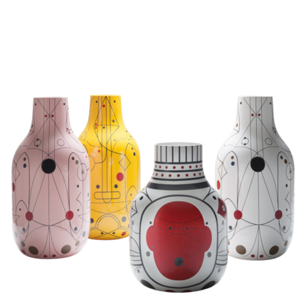 STRYPY VASES BY JAIME HAYON — four ceramic vases in pink, yellow, white, and black-white with surrealist line drawings, faces, and dot patterns.