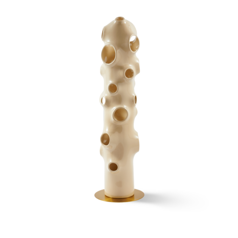 BULLE FLOOR LAMP BY PIERRE CARDIN with scattered circular bubble openings along organic tubular body on flat gold disc base