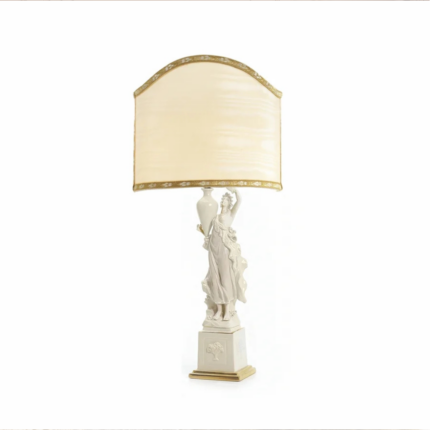 CRITEIDE TABLE LAMP WHITE with a classical draped female figurine raising an amphora on a gold-accented pedestal and arched cream silk shade
