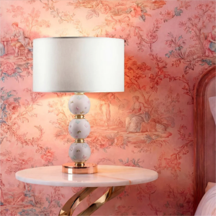 BUTTERFLY SPHERE TABLE LAMP PINK with three stacked white porcelain spheres in pastel pink relief butterflies and 24ct gold on a gold-plated brass base