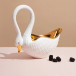 SWAN BOWL WHITE with hand-gilded 24K gold interior and beak, intricate feather detail — available in 3 sizes, luxury gift boxed