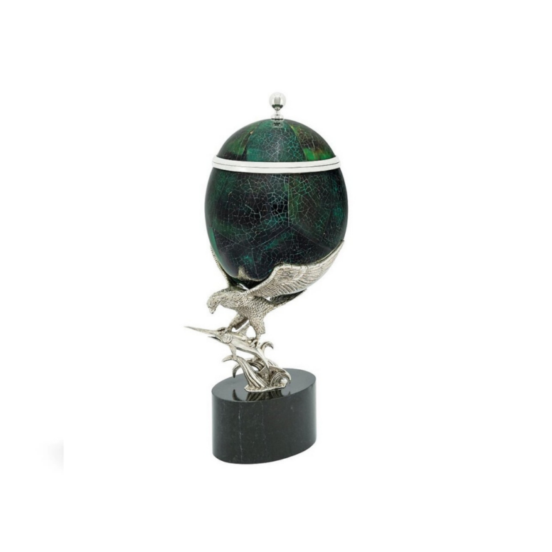 BOX PENSHELL ON EAGLE with silver finial, held aloft by a detailed silver eagle sculpture on dark oval marble base